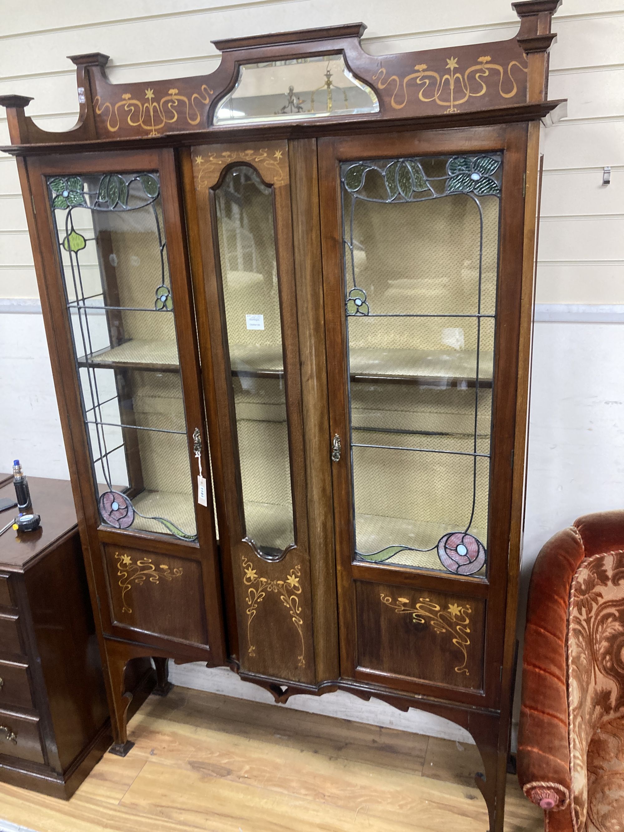 An Edwardian Art Nouveau marquetry inlaid mahogany display cabinet,